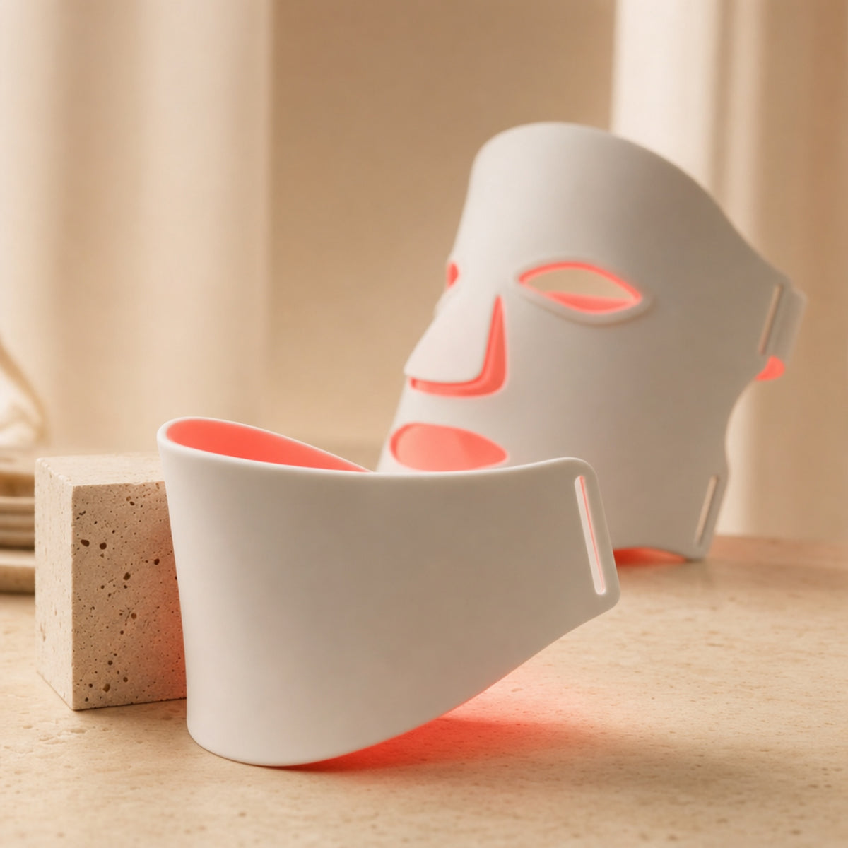 Redermis LED neck panel detail with red light glow [white]